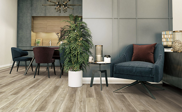 warm toned luxury vinyl in living room dining room with chairs and plant